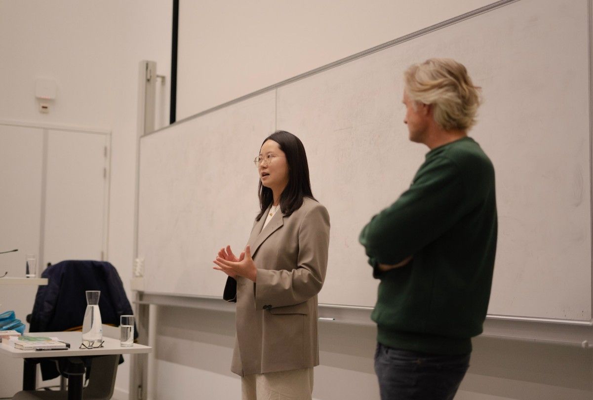 Xingyu Yang presenting alongside Martijn Bron