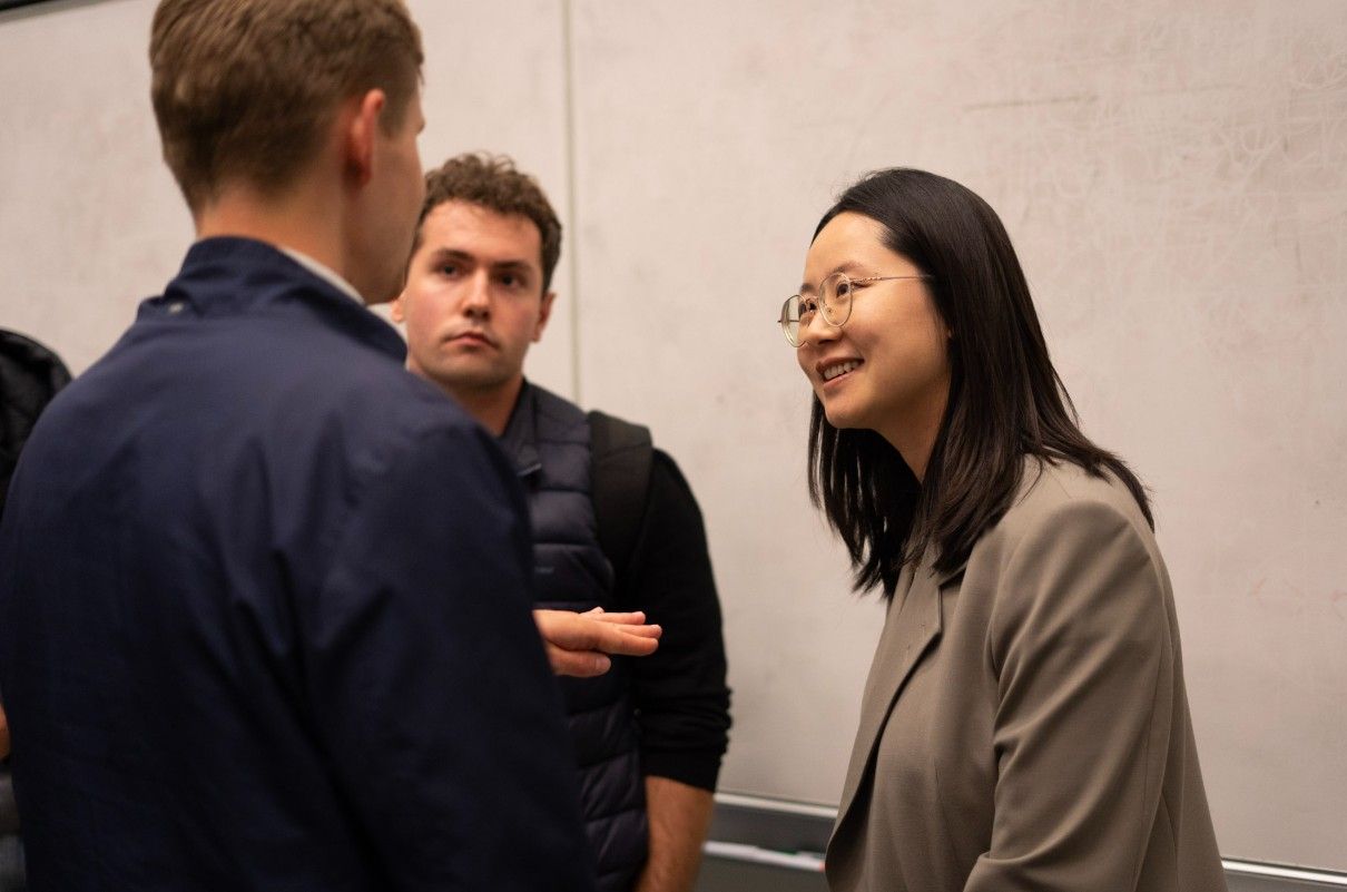 Xingyu Yang in conversation with attendees